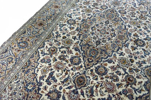 Backside of handmade 2000s Kashan rug showing knot structure and weave density
