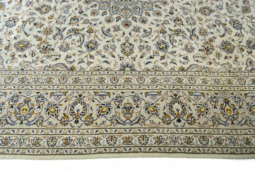Corner detail of 2000s Kashan rug showing border pattern and Wool pile