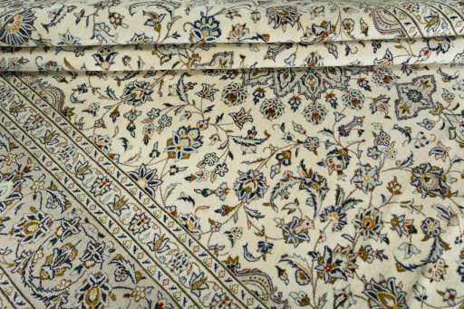 Close-up detail of 2000s Kashan rug from Iran / Persia showing Wool weave