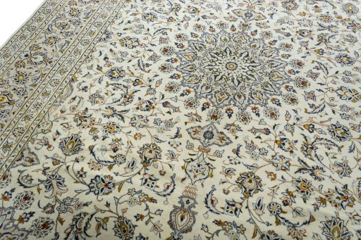 Backside of handmade 2000s Kashan rug showing knot structure and weave density