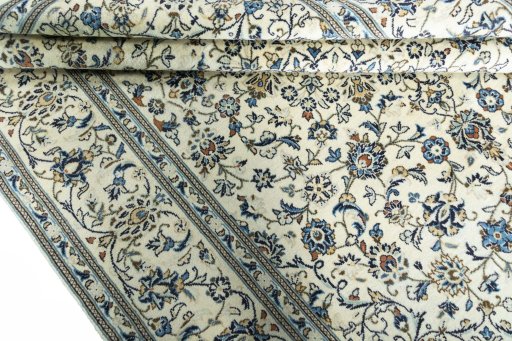 Close-up detail of 2000s Kashan rug from Iran / Persia showing Wool weave
