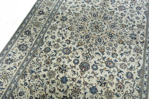 Backside of handmade 2000s Kashan rug showing knot structure and weave density