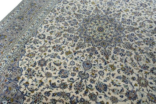 Backside of handmade 2000s Kashan rug showing knot structure and weave density