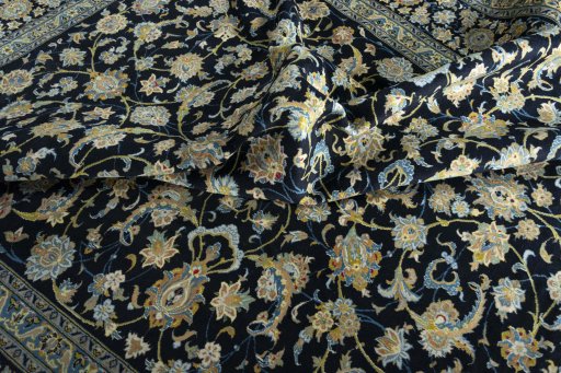 Close-up detail of 2000s Kashan rug from Iran / Persia showing Wool weave