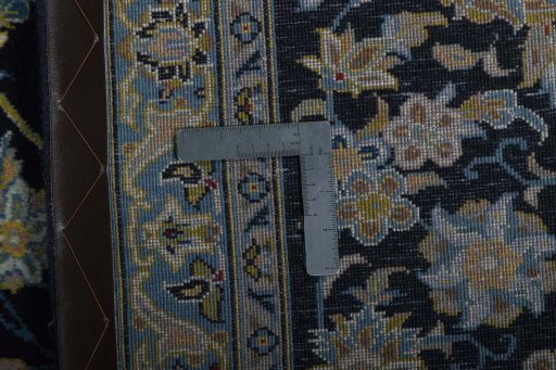Surface texture of 2000s Kashan rug with natural Wool and intricate pattern
