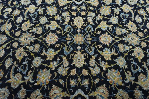 Backside of handmade 2000s Kashan rug showing knot structure and weave density