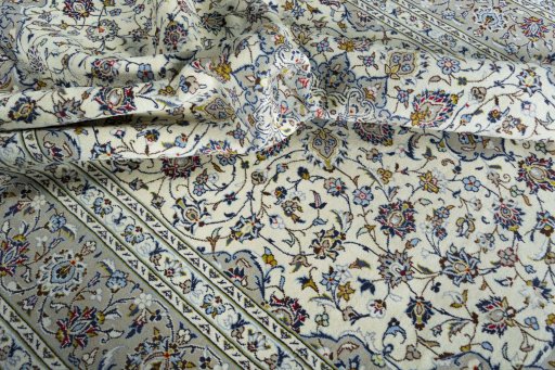 Surface texture of 2000s Kashan rug with natural Wool and intricate pattern