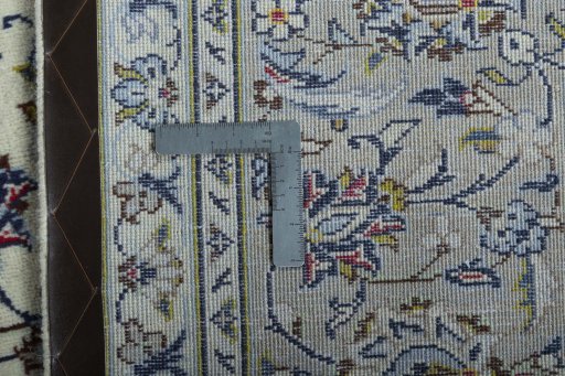 Backside of handmade 2000s Kashan rug showing knot structure and weave density