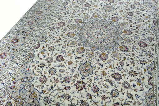 Backside of handmade 2000s Kashan rug showing knot structure and weave density