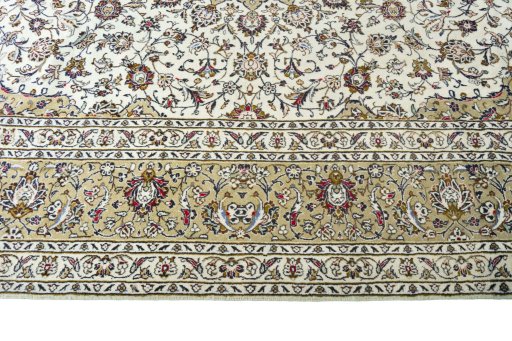 Corner detail of 2000s Kashan rug showing border pattern and Wool pile