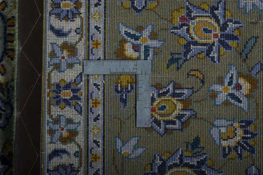 Backside of handmade 2000s Kashan rug showing knot structure and weave density