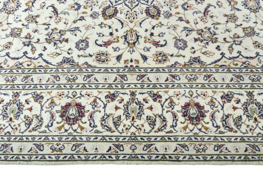 Corner detail of 2000s Kashan rug showing border pattern and Wool pile