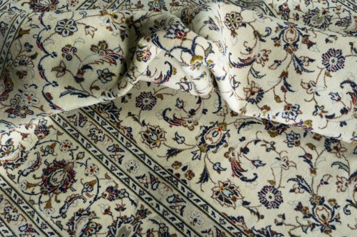 Surface texture of 2000s Kashan rug with natural Wool and intricate pattern