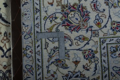 Backside of handmade 2000s Kashan rug showing knot structure and weave density