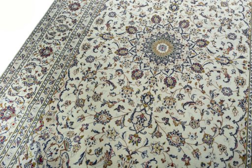 Backside of handmade 2000s Kashan rug showing knot structure and weave density