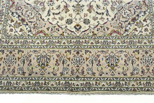 Corner detail of New Kashan rug showing border pattern and Wool pile