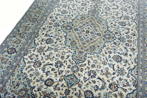 Backside of handmade 2000s Kashan rug showing knot structure and weave density