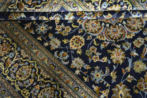 Close-up detail of 2000s Kashan rug from Iran / Persia showing Wool weave