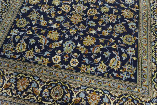 Close-up detail of 2000s Kashan rug from Iran / Persia showing Wool weave