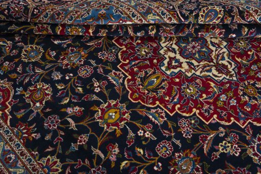 Close-up detail of 2000s Kashan rug from Iran / Persia showing Wool weave