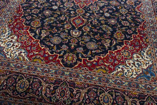 Close-up detail of 2000s Kashan rug from Iran / Persia showing Wool weave