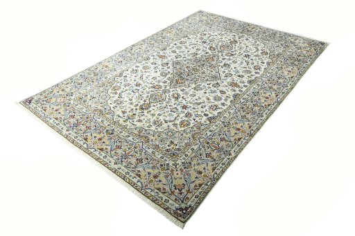Corner detail of 2000s Kashan rug showing border pattern and Wool pile