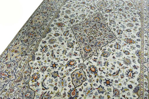 Backside of handmade 2000s Kashan rug showing knot structure and weave density