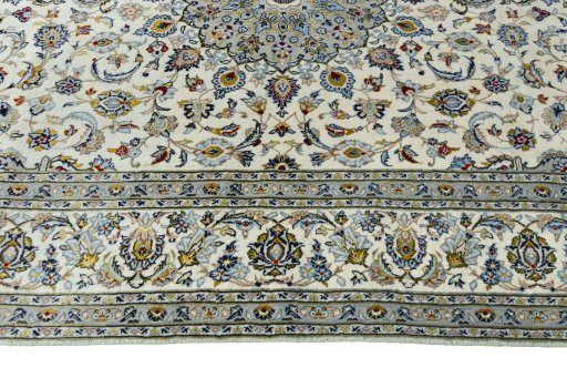 Corner detail of New Kashan rug showing border pattern and Cork pile