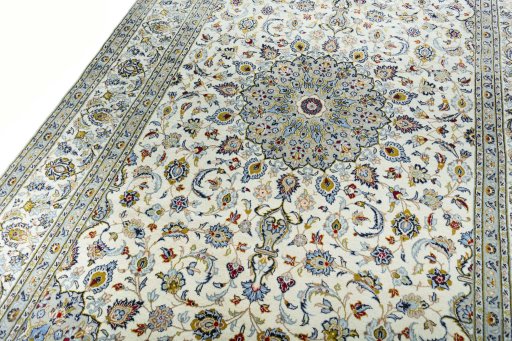 Backside of handmade New Kashan rug showing knot structure and weave density