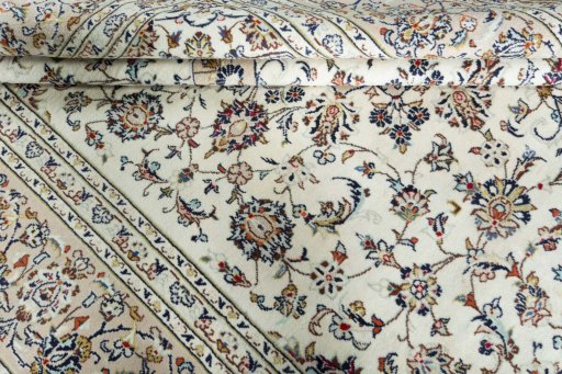 Close-up detail of 2000s Kashan rug from Iran / Persia showing Wool weave