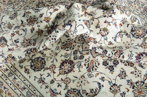 Surface texture of 2000s Kashan rug with natural Wool and intricate pattern