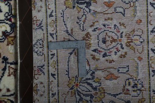 Backside of handmade 2000s Kashan rug showing knot structure and weave density