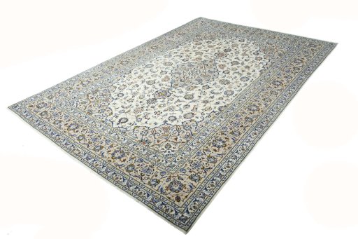 Corner detail of 2000s Kashan rug showing border pattern and Wool pile
