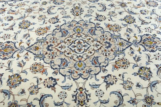 Backside of handmade 2000s Kashan rug showing knot structure and weave density