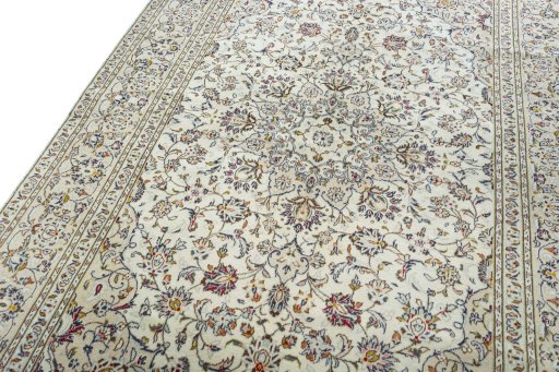 Backside of handmade 2000s Kashan rug showing knot structure and weave density