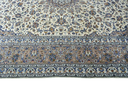 Corner detail of New Kashan rug showing border pattern and Wool pile
