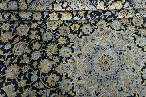 Close-up detail of 2000s Kashan rug from Iran / Persia showing Wool weave