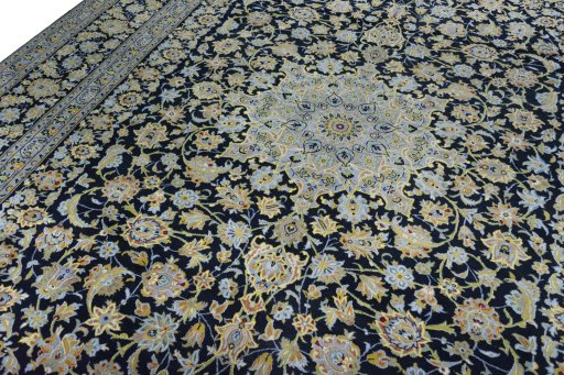 Backside of handmade 2000s Kashan rug showing knot structure and weave density