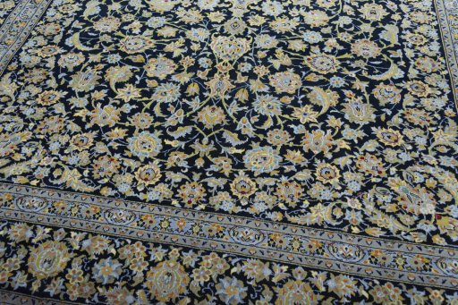 Close-up detail of 2000s Kashan rug from Iran / Persia showing Wool weave