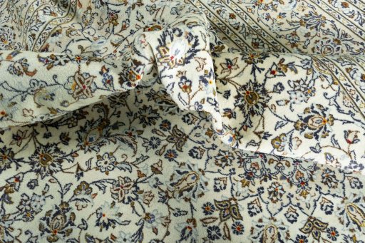Surface texture of 2000s Kashan rug with natural Wool and intricate pattern