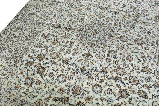 Backside of handmade 2000s Kashan rug showing knot structure and weave density