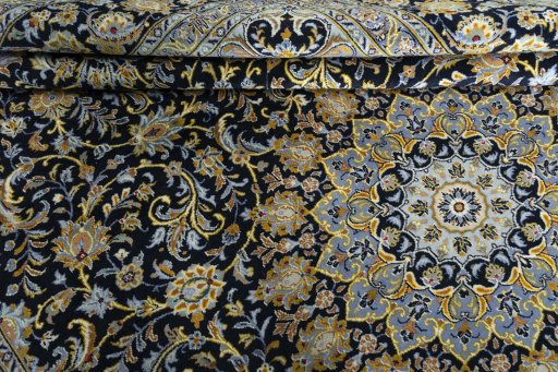Close-up detail of 2000s Kashan rug from Iran / Persia showing Wool weave
