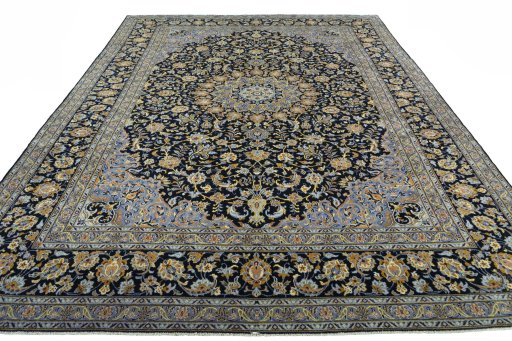 Surface texture of 2000s Kashan rug with natural Wool and intricate pattern