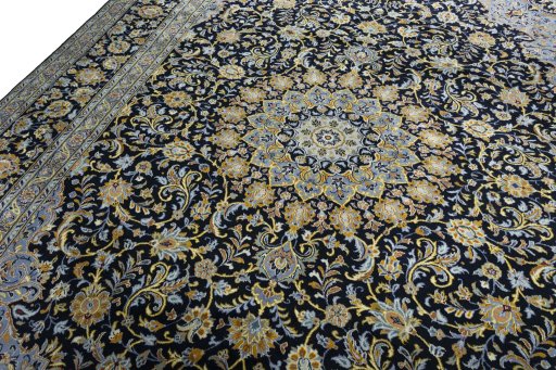 Backside of handmade 2000s Kashan rug showing knot structure and weave density