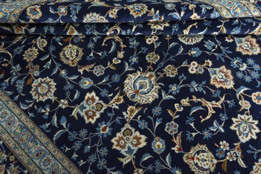 Close-up detail of 2000s Kashan rug from Iran / Persia showing Wool weave