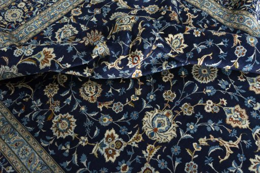 Surface texture of 2000s Kashan rug with natural Wool and intricate pattern