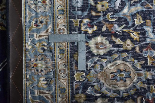 Backside of handmade 2000s Kashan rug showing knot structure and weave density