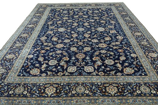 Surface texture of 2000s Kashan rug with natural Wool and intricate pattern