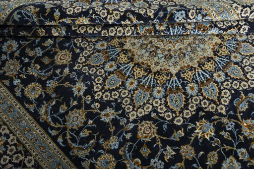Close-up detail of 2000s Kashan rug from Iran / Persia showing Wool weave