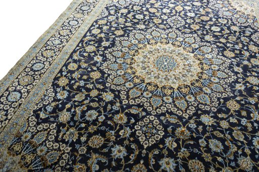 Backside of handmade 2000s Kashan rug showing knot structure and weave density